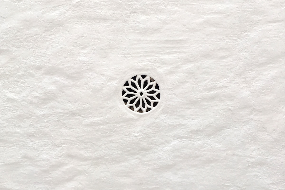 Geometric pattern carved into white paper